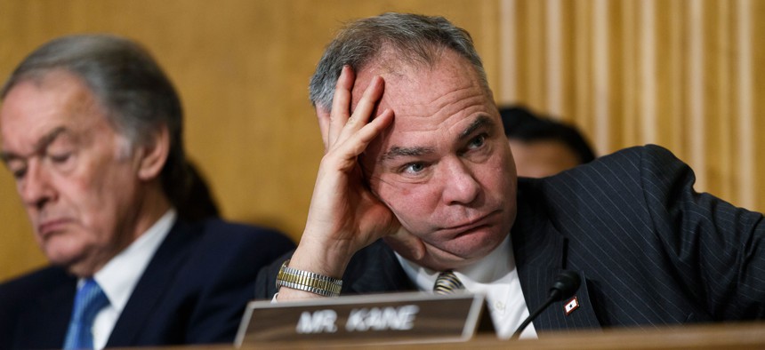 Sen. Tim Kaine, D-Va., center, with Sen. Edward J. Markey, D-Mass., at left, listen as Secretary of State Kerry appears before the Senate Foreign Relations Committee at the Capitol in Washington, Tuesday, April 8, 2014.