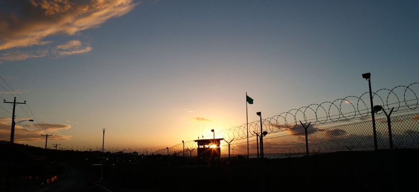 In this photo reviewed by the U.S. military, the sun rises above Camp Delta at Guantanamo Bay Naval Base, Cuba, Wednesday, Nov. 20, 2013.