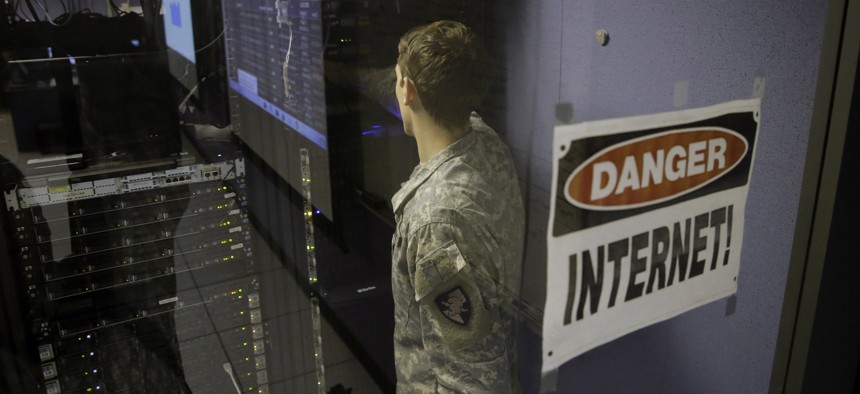 A United States Military Academy cadet checks computers at the Cyber Research Center at the United States Military Academy in West Point, N.Y., Wednesday, April 9, 2014.