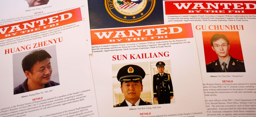 In this May 19, 2014, file photo, press materials are displayed on a table of the Justice Department in Washington.