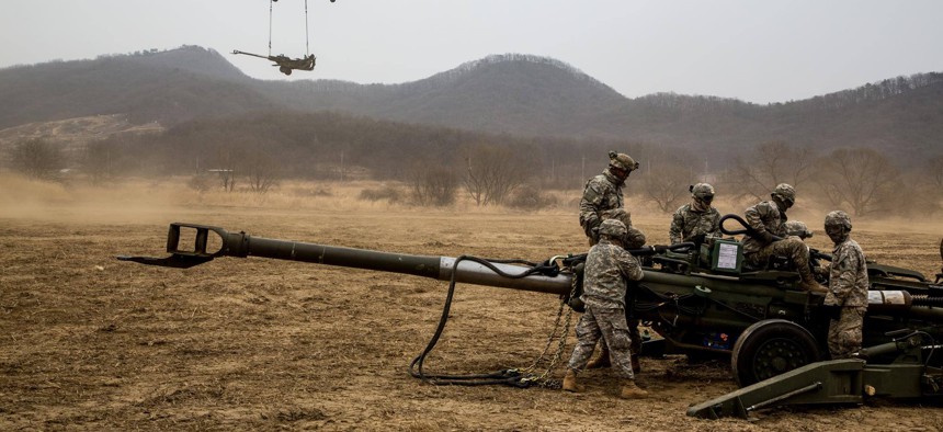 Soldiers assigned to 2nd Stryker Brigade Combat Team, 25th Infantry Division, conduct air assault sling load training on Warrior Base, New Mexico Range, in the Republic of Korea, on March 18, 2015.