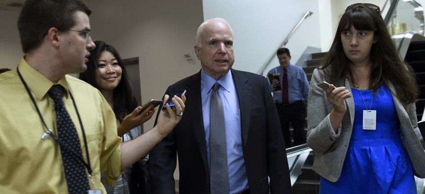 Sen. John McCain, R-Ariz., is pursued by reporters on Capitol Hill in Washington, Thursday, June 4, 2015.