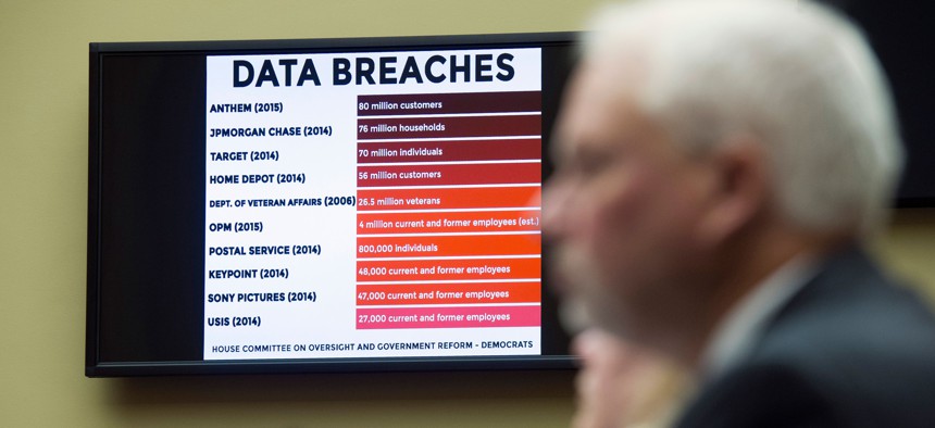 A chart of data breaches is shown on Capitol Hill in Washington, Tuesday, June 16, 2015, as witnesses testify before the House Oversight and Government Reform committee's hearing on the Office of Personnel Management (OPM) data breach.