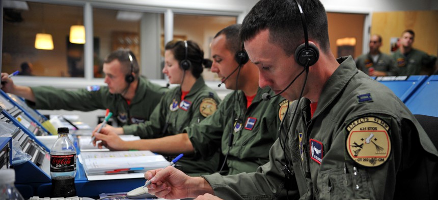 Members of the 576th Flight Test Squadron conduct pre-flight operations for a Minuteman III ICBM at Vandenberg Air Force Base, Calif. Pentagon officials are standing up a new facility to back up Vandenberg’s Joint Space Operations Center.
