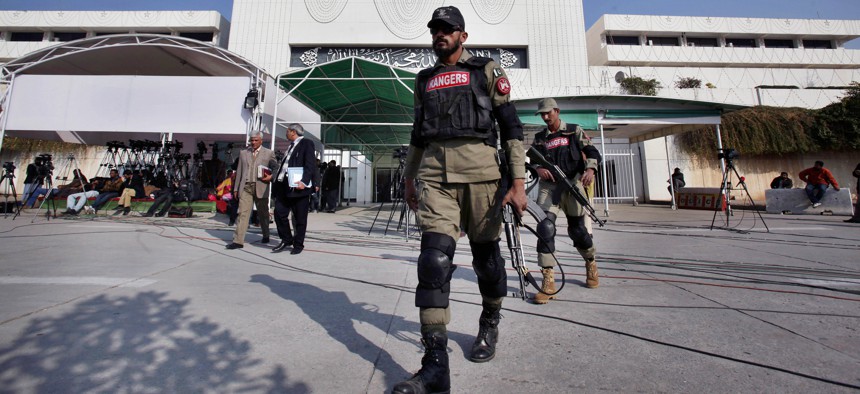 Pakistani paramilitary soldiers patrol at the premises of National Assembly building during an assembly session Tuesday, Jan. 6, 2015 in Islamabad, Pakistan, Tuesday, Jan. 6, 2015.