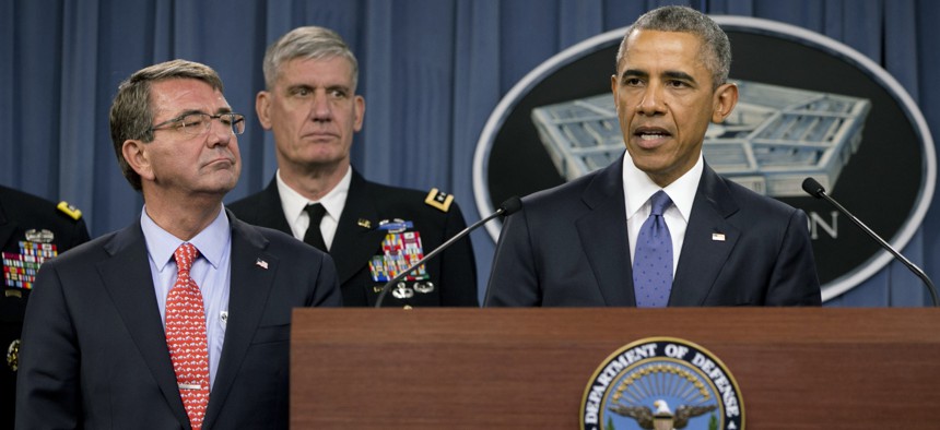 President Barack Obama, right, speaks to the media after receiving an update from military leaders on the campaign against the Islamic State, during a rare visit to the Pentagon on Monday, July 6, 2015. 