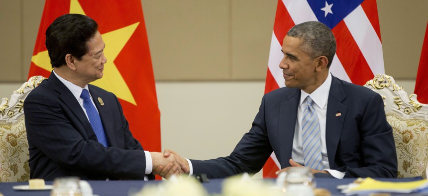 U.S. President Barack Obama, right, and Vietnam's Prime Minister Nguyen Tan Dung, shake hands during their bilateral meeting at the Myanmar International Convention Center, Thursday, Nov. 13, 2014 in Naypyitaw, Myanmar.
