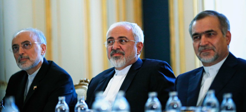Iranian Foreign Minister Javad Zarif, centre, Head of the Iranian Atomic Energy Organization Ali Akbar Salehi, left, and Hossein Fereydoon, brother and close aide to President Hassan Rouhani meet with Secretary of State John Kerry, on July 3, 2015.
