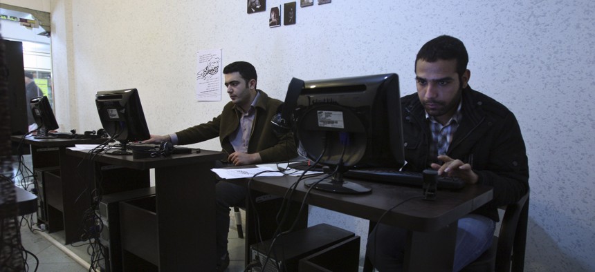 In this picture taken on Tuesday, Jan. 18, 2011, Iranian journalism students use computers in an internet cafe in central Tehran, Iran.