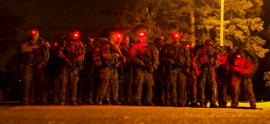 U.S. Army Soldiers conduct a 12-mile foot march during the Ranger Course on Fort Benning, GA., April 23, 2015. 