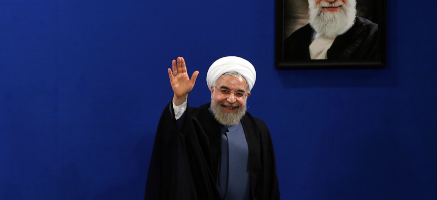 Iran's President Hassan Rouhani waves to reporters at the conclusion of his press conference on the second anniversary of his election, in Tehran, Iran, Saturday, June 13, 2015. 
