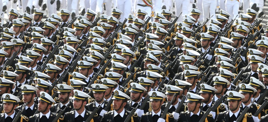 Iranian navy troops march in a parade marking National Army Day in front of the mausoleum of the late revolutionary founder Ayatollah Khomeini, just outside Tehran, Iran, Saturday, April 18, 2015.
