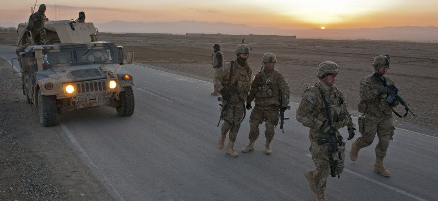 US Army soldiers from Task Force Blackhawk set up a traffic checkpoint at Combat Outpost Yosef Khel, on March 8, 2012.