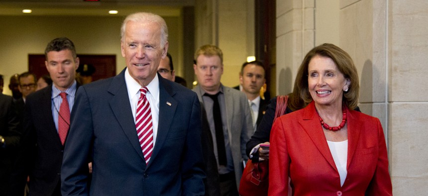 Vice President Joe Biden and House Minority Leader Nancy Pelosi of Calif., leave a meeting with the House Democratic Caucus to discuss the Iran nuclear deal, Wednesday, July 15, 2015.