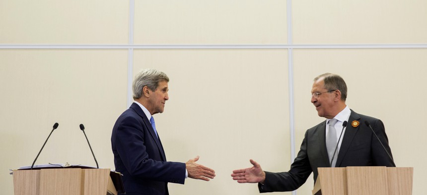 Russian Foreign Secretary Sergey Lavrov, right, and U.S. Secretary of State John Kerry, shake hands during a news conference at the presidential residence of Bocharov Ruchey in Sochi, Russia, Tuesday May 12, 2015. 