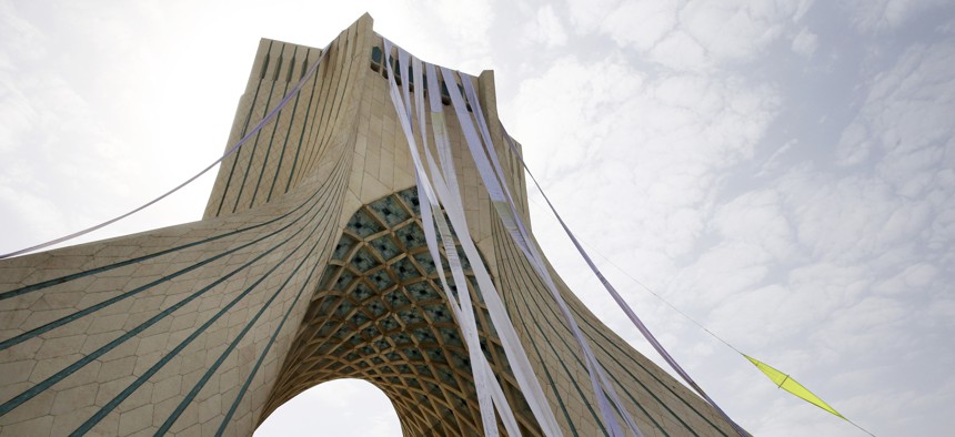 Petition scrolls hang from the Azadi (Freedom) tower during a demonstration of a group of hard-liners demanding Iranian nuclear negotiators to sign a “good deal” with 5+1 countries that reserves rights of the Iranian nation, in Tehran, Iran, Tuesday, June
