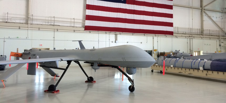 A lonely Predator drone sits in an airplane hanger at the Creech, Air Force base in Nevada, June, 2015.