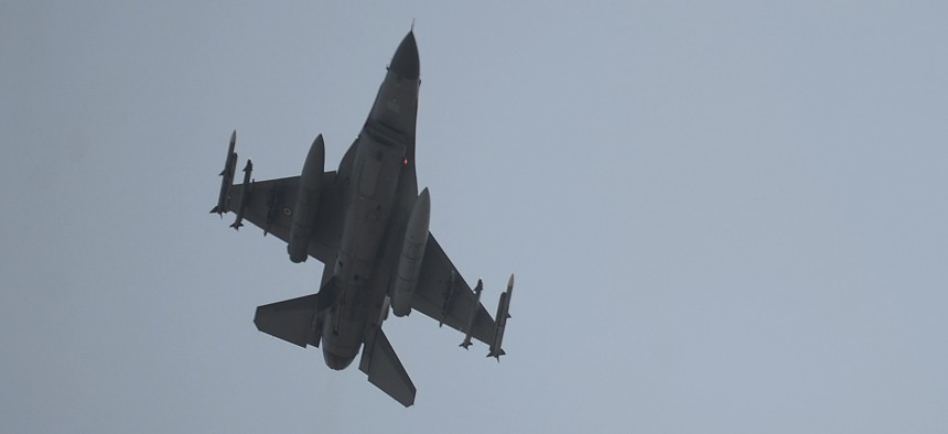 A Turkish Air Force fighter plane flies over the Incirlik Air Base, in Adana, southern Turkey.
