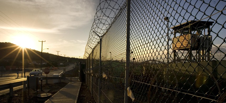 In this photo reviewed by the U.S. Military, the sun rises over Camp Delta detention compound at Guantanamo Bay U.S. Naval Base, in Cuba.
