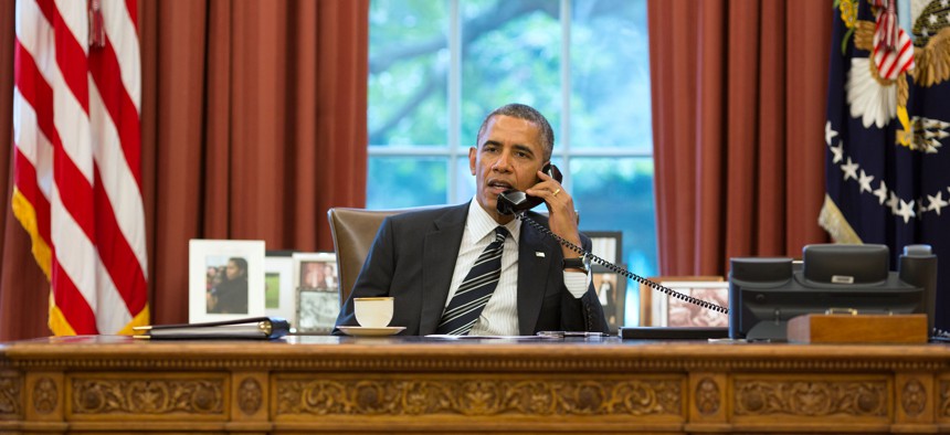 President Barack Obama talks with President Hassan Rouhani of Iran during a phone call in the Oval Office, Sept. 27, 2013. 