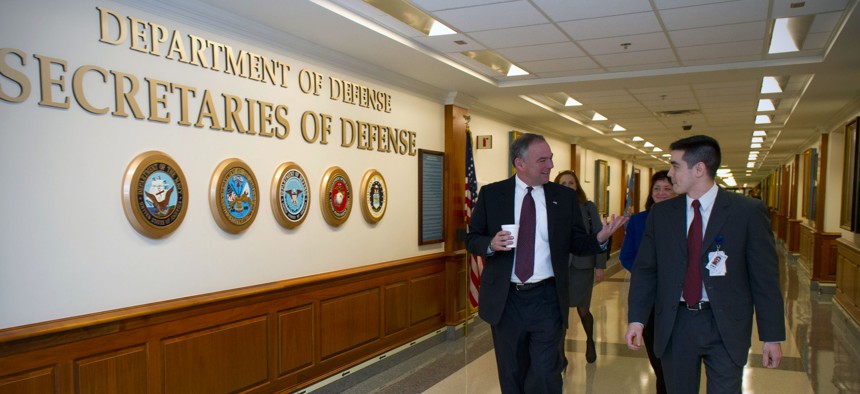 U.S. Sen. Tim Kaine, left, walks down a hall at the Pentagon in Arlington, Va., March 4, 2013. The Virginia senator met with senior military leaders, Department of Defense employees and constituents to discuss the effects of sequestration.