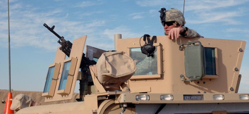 Soldiers use the Objective Gunner Protection Kit mounted on an M114 Humvee in Iraq. The OGPK was named one of the Army's 10 Greatest Inventions for 2007. Rock Island Arsenal produced approximately 28,000 OGPKs.
