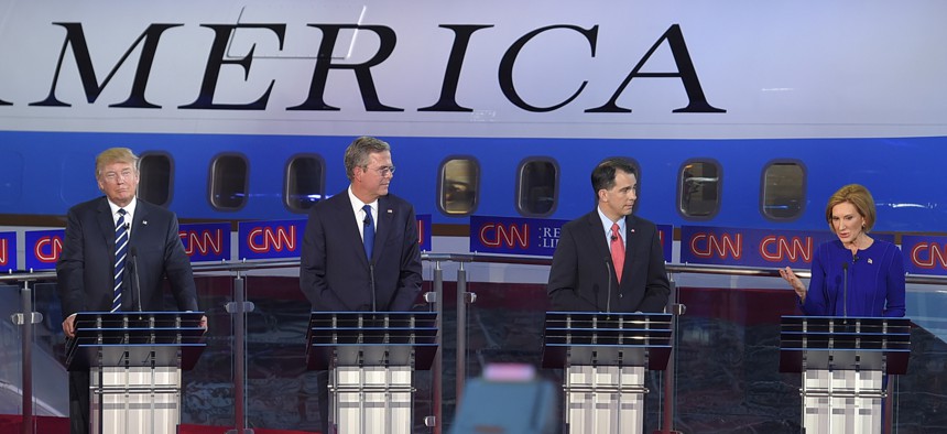 Carly Fiorina, right, with Donald Trump, Jeb Bush, and Scott Walker, talked tough on U.S. military force abroad at the CNN Republican presidential debate, Sept. 16, 2015, in Simi Valley, Calif. 