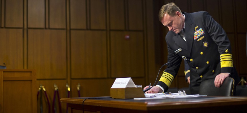 Director of the National Security Agency (NSA) Adm. Michael Rogers, waits for the arrival of Senate Intelligence Committee members before taking their seats on Thursday, September 24, 2015.
