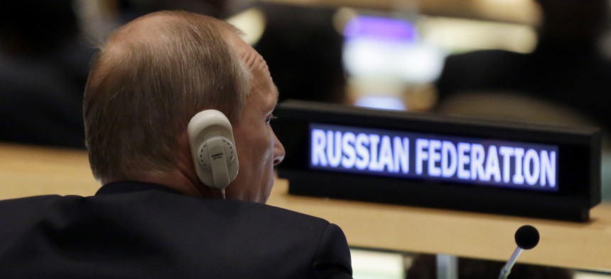 Russia's President Vladimir Putin listens to addresses in the 70th session of the United Nations General Assembly, Monday, Sept. 28, 2015.