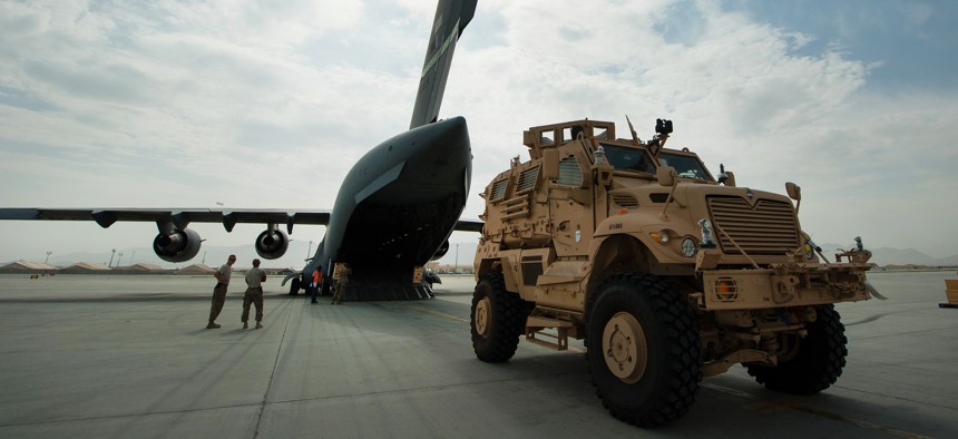 In Afghanistan, a U.S. Army mine-resistant, ambush-protected, or MRAP, vehicle offloads from an Air Force C-17 Globemaster III aircraft at Bagram Airfield, Sept. 21, 2015. 