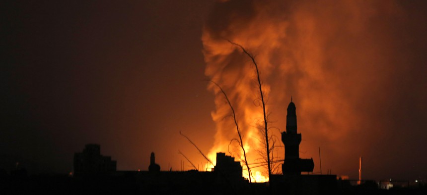 Fire from a Saudi-led airstrike illuminates the night over Sanaa, Yemen, Thursday, Sept. 17, 2015. 