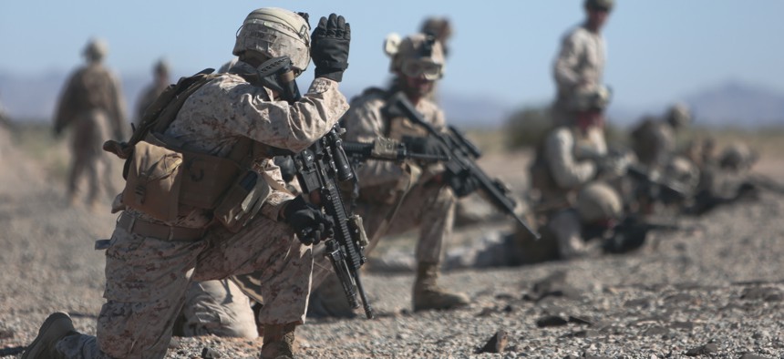 U.S. Marines with 2nd Battalion, 7th Marine Regiment, 1st Marine Division, 1st Marine Expeditionary Force set up perimeter security during a fast rope exercise at Auxiliary Airfield 2, Yuma, Ariz., Oct. 2, 2015.