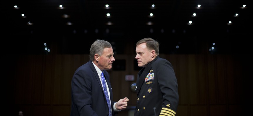 Senate Intelligence Committee Chairman Sen. Richard Burr, R-N.C., left, talks with Director of the National Security Agency (NSA) Adm. Michael Rogers on Capitol Hill, Thursday, Sept. 24, 2015, prior to Rogers testifying before the committee.