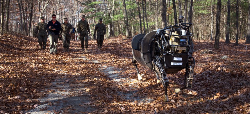 Marines with 1st Battalion, 5th Marine Regiment, test the capabilities of the Legged Squad Support System (LS3), aboard Fort Devens, Mass., Nov. 5, 2013.