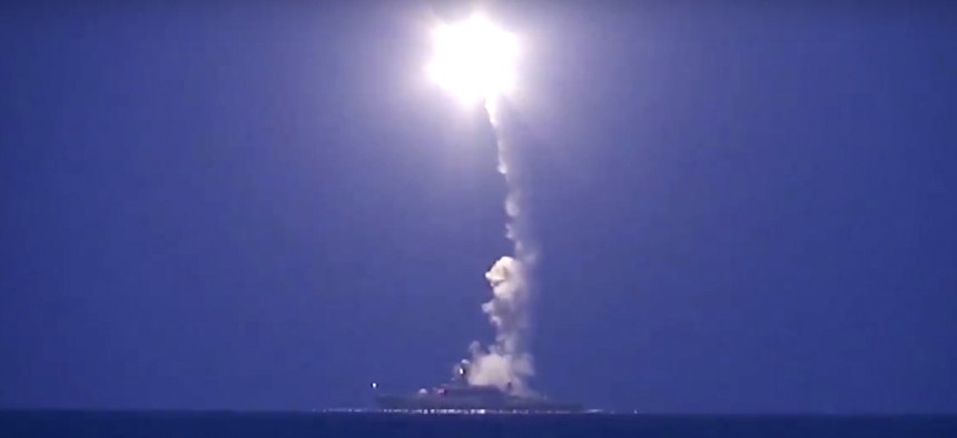 In this photo made from the footage taken from Russian Defense Ministry official web site, Wednesday, Oct. 7, 2015, a Russian navy ship launches a cruise missile in the Caspian Sea.