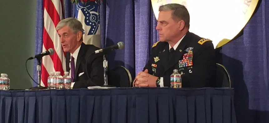 Army Secretary John McHugh and Army Chief of Staff Gen. Mike Milley talk Monday at AUSA.