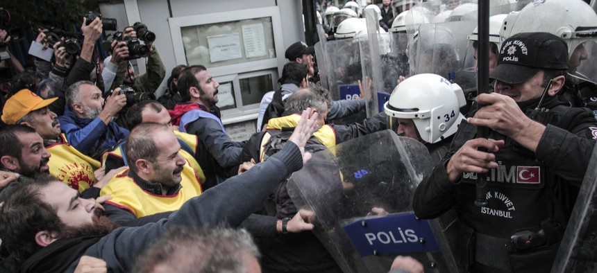 Protesters clash with police in Istanbul, Turkey, Tuesday, Oct. 13, 2015.