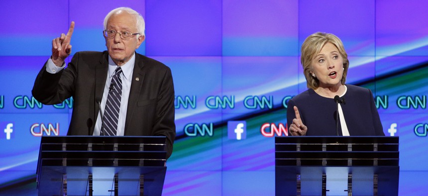 Former Secretary of State Hillary Clinton and Vermont Sen. Bernie Sanders spar at the CNN Democratic presidential debate in Las Vegas, Tues, Oct. 13, 2015.