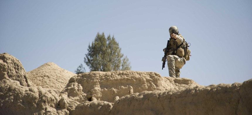 A U.S. Special Forces sergeant directs security positions during a patrol Feb. 20, 2011 in Panjwai District, Kandahar province, Afghanistan. 