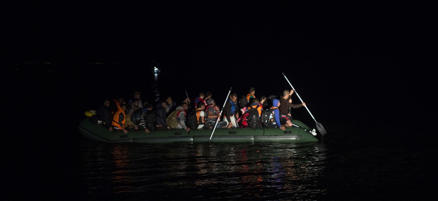 Migrants and refugees arrive on a dinghy from the Turkish coast to the northeastern Greek island of Lesbos, Monday, Oct. 19, 2015. More than 600,000 people, mostly Syrians, have reached Europe since the beginning of this year.