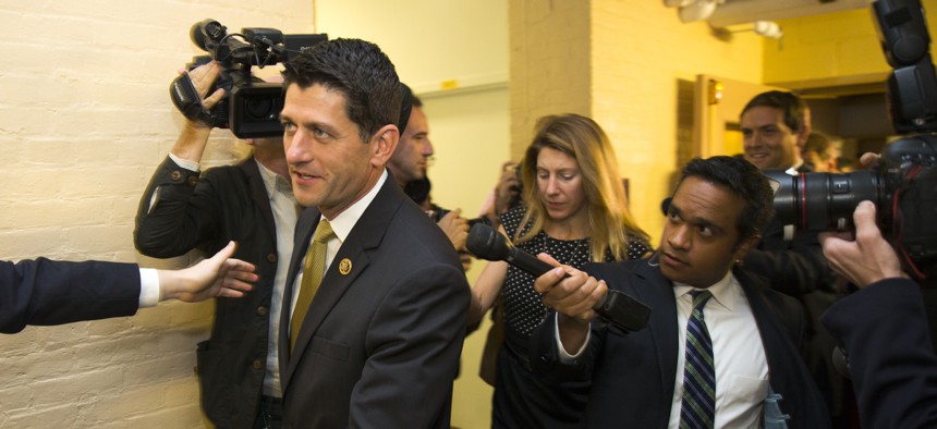 Rep. Paul Ryan, R-Wis. is pursued by members of the media as he arrives for a House GOP conference meeting on Capitol Hill in Washington, Wednesday, Oct. 21, 2015.