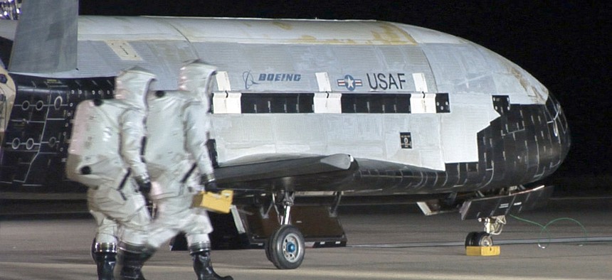 The USAF Rapid Capabilites Office help produce the X-37B Orbital Test Vehicle, a semi-secret space plane that sits on the runway after landing on Dec. 3, 2010, at Vandenberg Air Force Base, Calif.