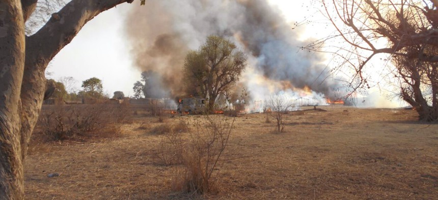 In this photo made available by the Nigerian Military taken Tuesday, April 28, 2015, an Islamic extremist camp burns after it was allegedly destroyed by Nigerian military personnel during a attack on Islamic extremists positions in the Sambisa Forest, Nig