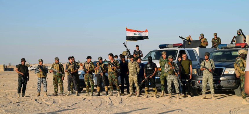 Sunni volunteer tribal fighters in the eastern suburbs of Ramadi, the capital of Iraq's Anbar province, Oct. 11, 2015. 