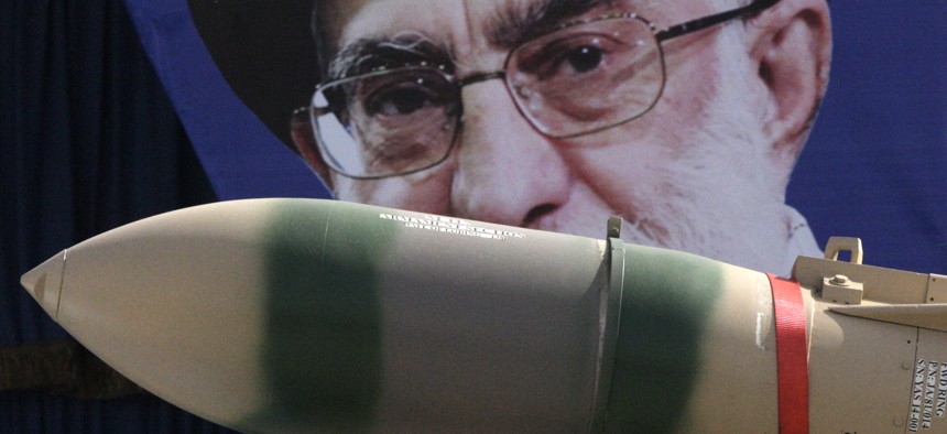In this Thursday, April 18, 2013 file photo, a Yaser missile is displayed by the Iranian army in front of a portrait of supreme leader Ayatollah Ali Khamenei during a parade marking National Army Day.