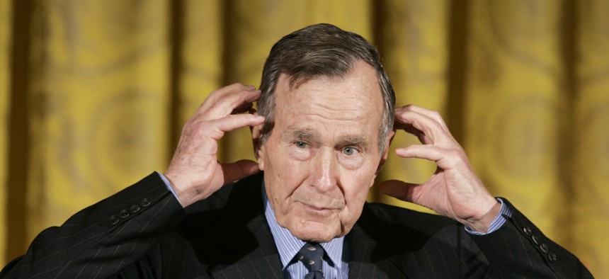 Former President George H.W. Bush gestures while telling a story as he speaks during a presentation ceremony for the Hugh S. Sidey Scholarship in Print Journalism, during a ceremony in the East Room of the White House in Washington Friday, Jan. 26, 2007.