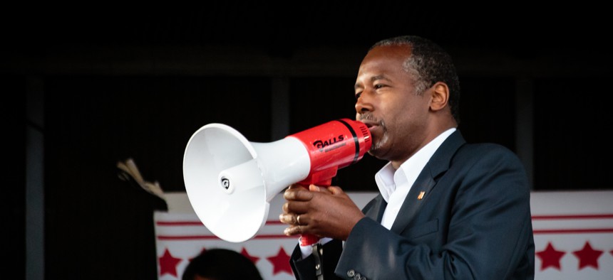 Ben Carson uses a megaphone during a speech.