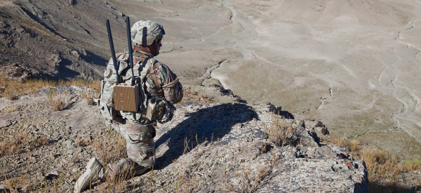 A U.S. Soldier of Bandit Troop 1st (Tiger) Squadron 3rd Cavalry Regiment provides overwatch security while soldiers move up Pride Rock mountain to witness the reenlistment of two U.S. Soldiers in Paktya province, Afghanistan.