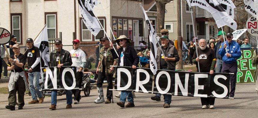 A protest of drones at the Minneapolis MayDay Parade and Festival 2013.