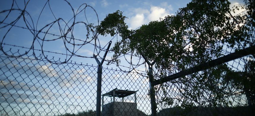 Concertina wire is overgrown with foliage in the now abandoned Camp X-Ray, Guantanamo Bay, Cuba which was used as the first detention facility for al-Qaida and Taliban militants who were captured after the Sept. 11 attacks.
